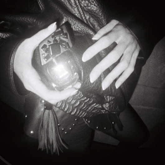 Hands holding flacon top view